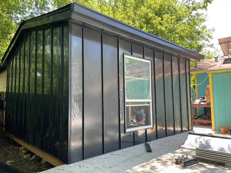 Black standing seam metal wall panels for Roof Inspection in Gering